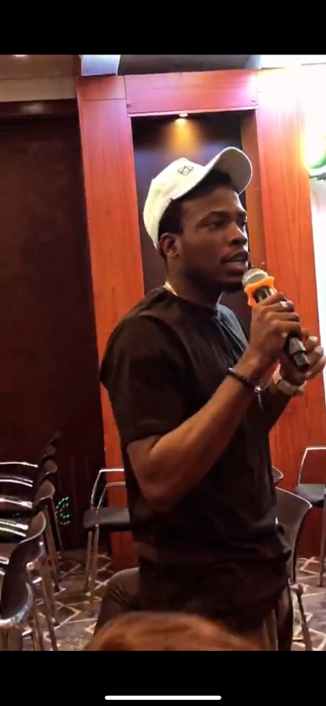 Speaking with mic at event